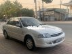 Ford Laser Deluxe 2000 - Cần bán gấp Ford Laser Deluxe sản xuất 2000, màu trắng, số sàn